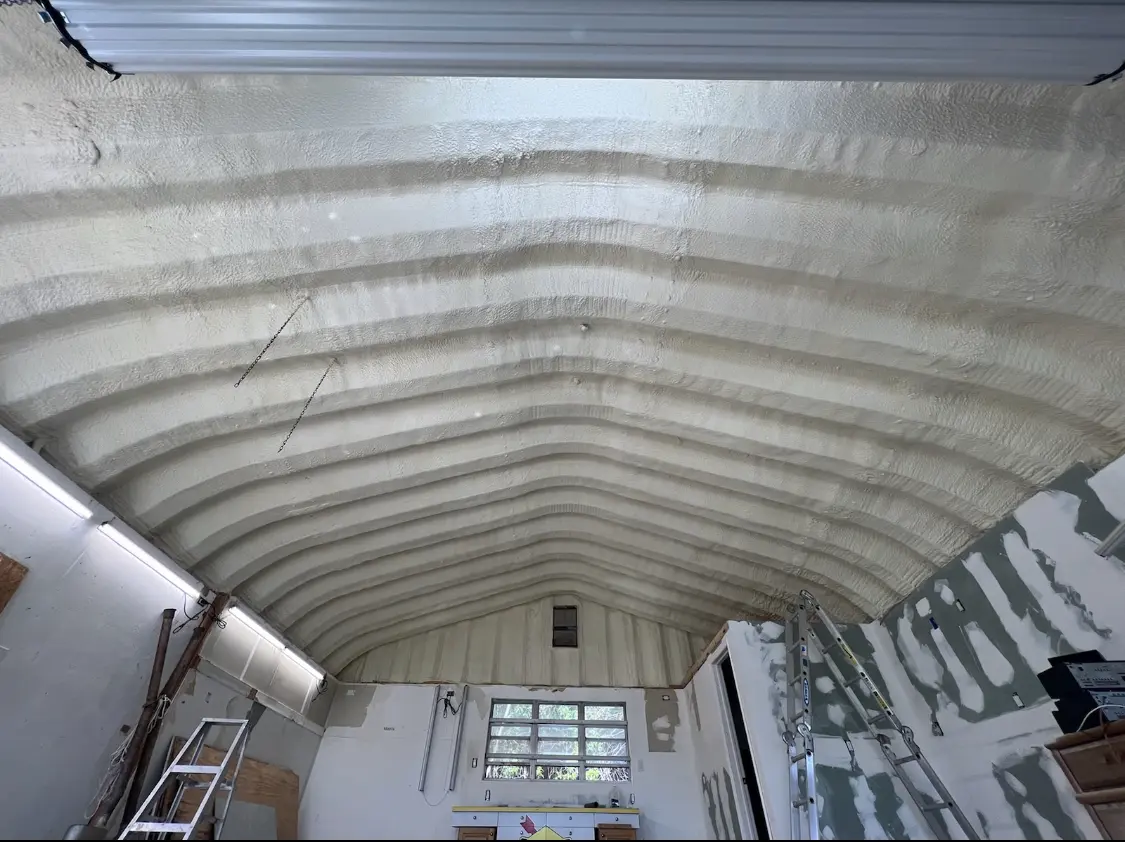 Spray polyurethane foam applied to the underside of a metal roof deck in Windsor